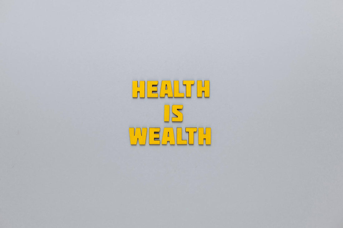 Yellow text 'HEALTH IS WEALTH' on a light gray background