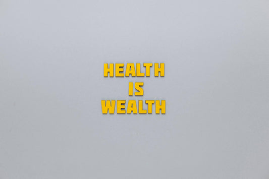 Yellow text 'HEALTH IS WEALTH' on a light gray background