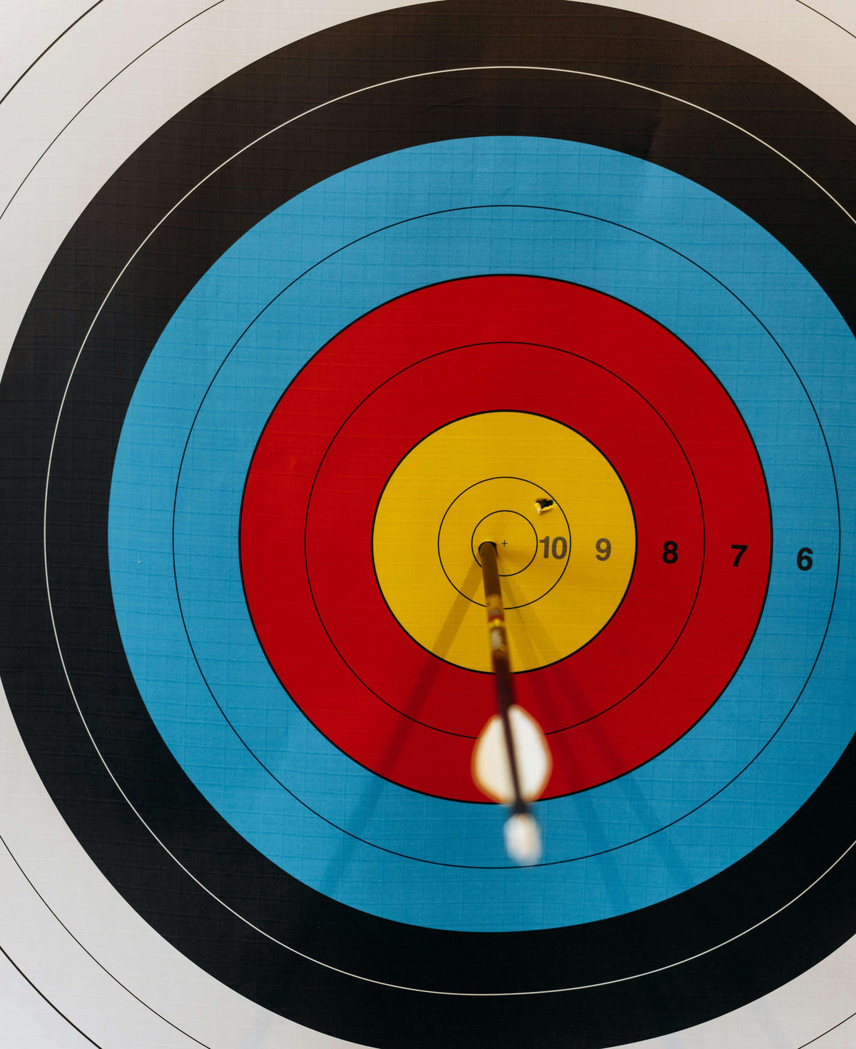 Archery target with a bow arrow in the center